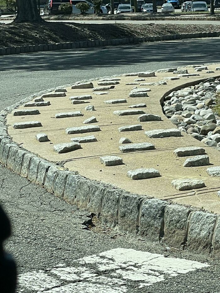 This Sidewalk That People Cemented Stones To