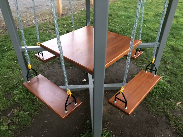 Why Have A Picnic Table And A Swing, When You Can Have The Worst Of Both Worlds?
