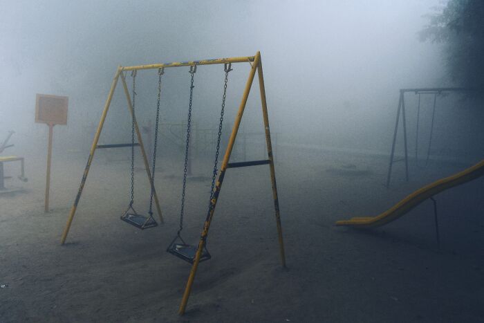 Ethereal Playground. I Saw A Bunch Of Kids Playing In The Slides And They Were Barely Visible Through The Thick Fog, You Could Only Hear Their Laughter And Scurrying Footsteps