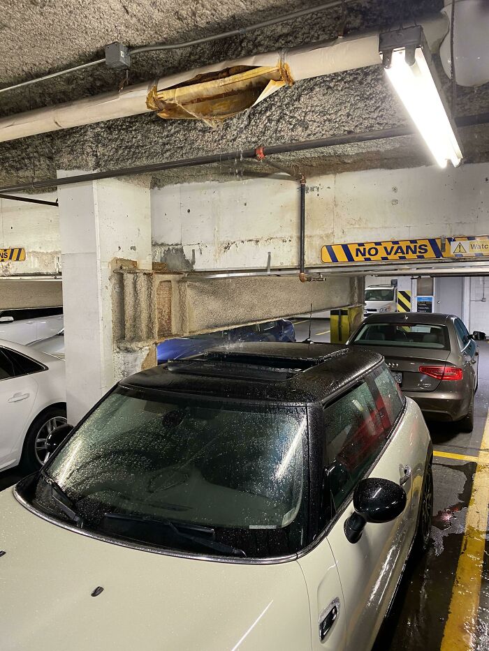 Someone Parked Underground With Their Sunroof Open And A Pipe Burst Above Them