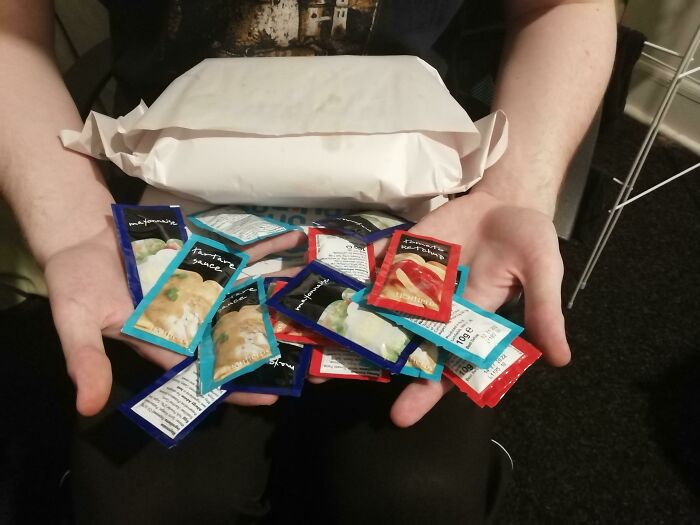 I Asked For "A Bit Of Extra Sauce On The Side" And Was Hit With 31 Packets Of Assorted Sauces