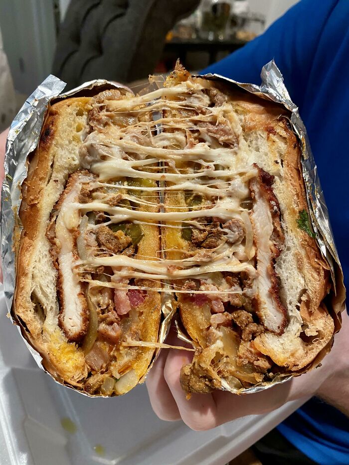 Mexican Torta With Chicken, Pork, Steak, Bacon, Cheese, Onions, And Jalapeños