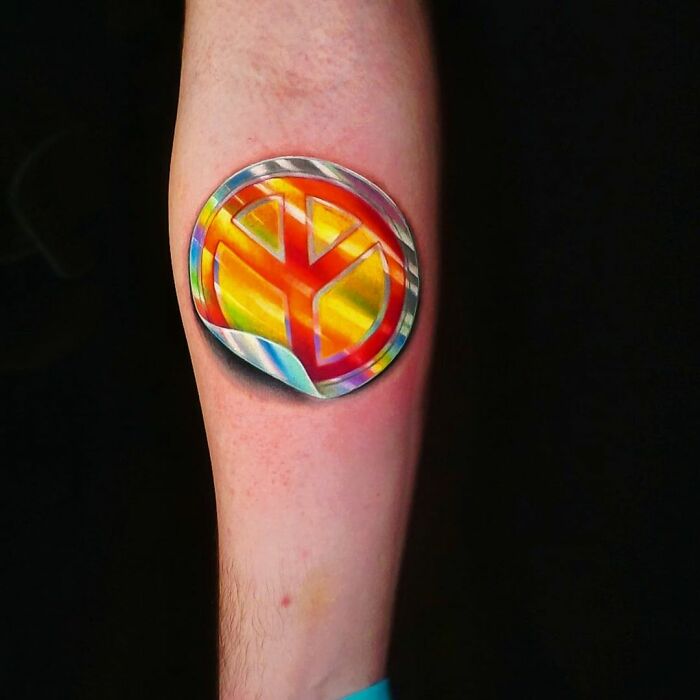 Brazilian Tattoo Artist Makes Tattoos That Look Like Holofoil Stickers