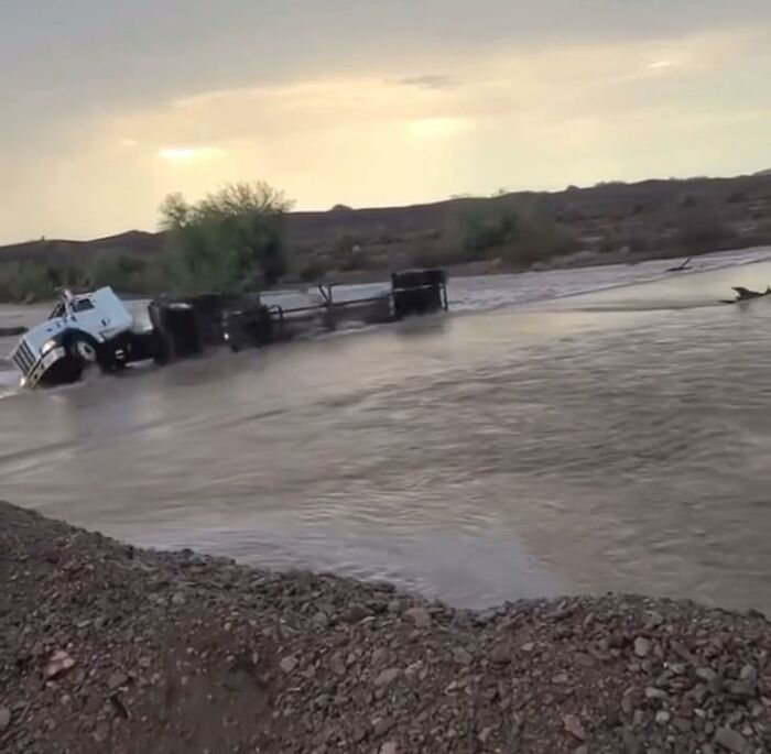 Semi-Truck Drives Straight Into Flood Waters