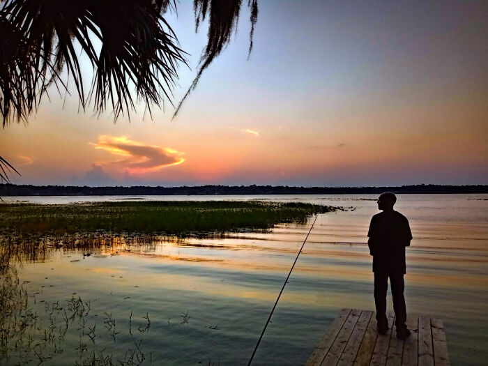 My Husband At Sunset On Lake Hernando In Florida, USA.