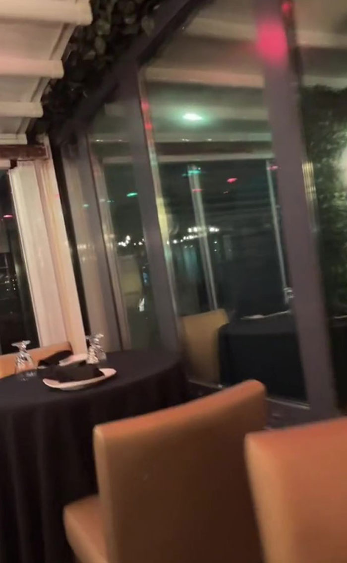 Lady Shows Tiktok How She Settled In An AirBnB Only To Discover Her Window Was A One-Way Mirror Into A Restaurant
