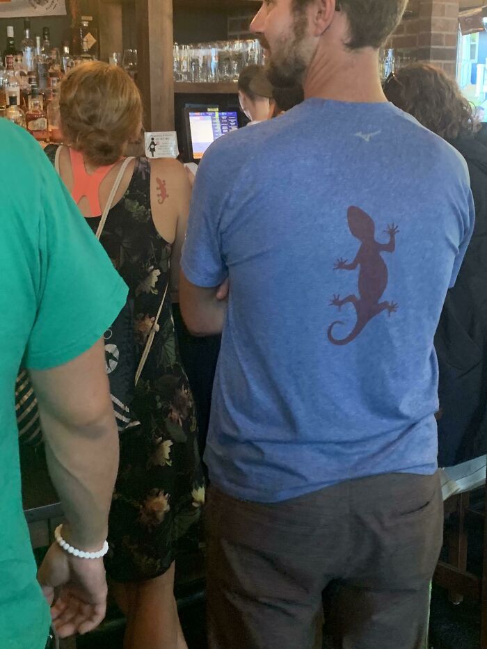 This Woman Has A Tattoo On Her Shoulder That Is The Exact Same As The Design On This Guys Shirt
