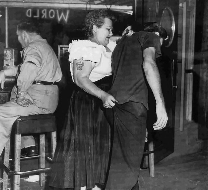 "Cairo Mary," Bouncer At Shanghai Reds (5th And Beacon In San Pedro, Ca) Escorts A Customer To The Door. 1953