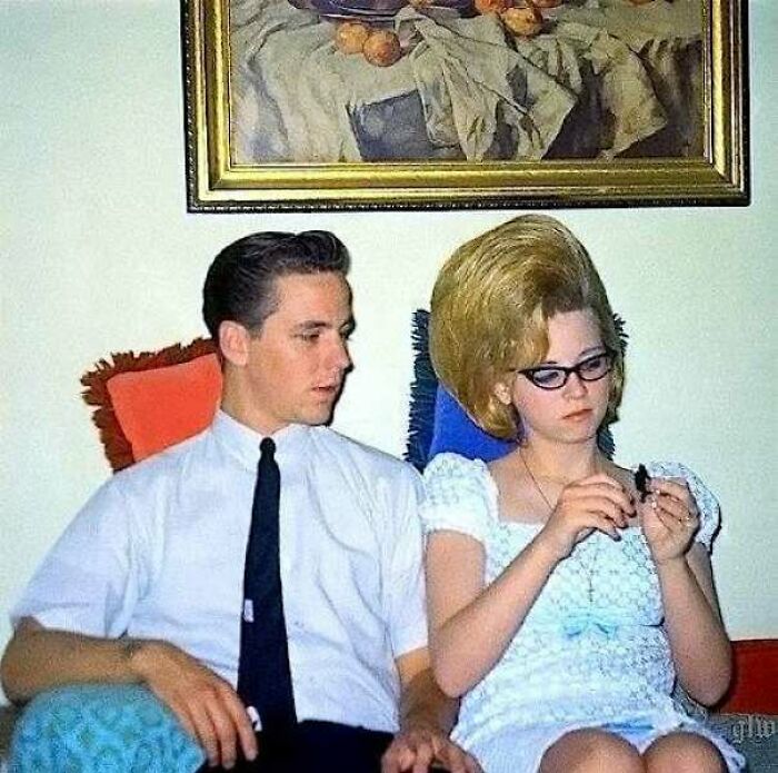Young Man Watching Whatever His Date/Girlfriend Is Doing. Circa 1959
