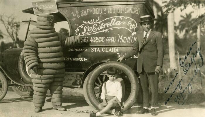 A Michelin Mascot Stands Next To An Advertising Vehicle In Santa Clara, 1926