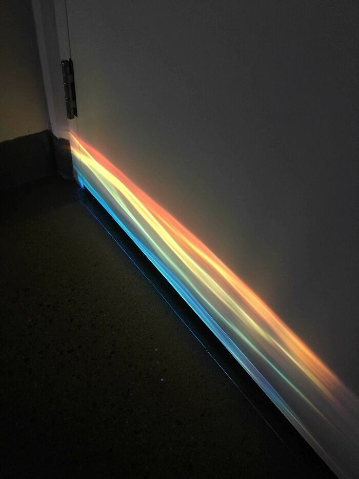 Light Shining Through Glass Door Created A Rainbow