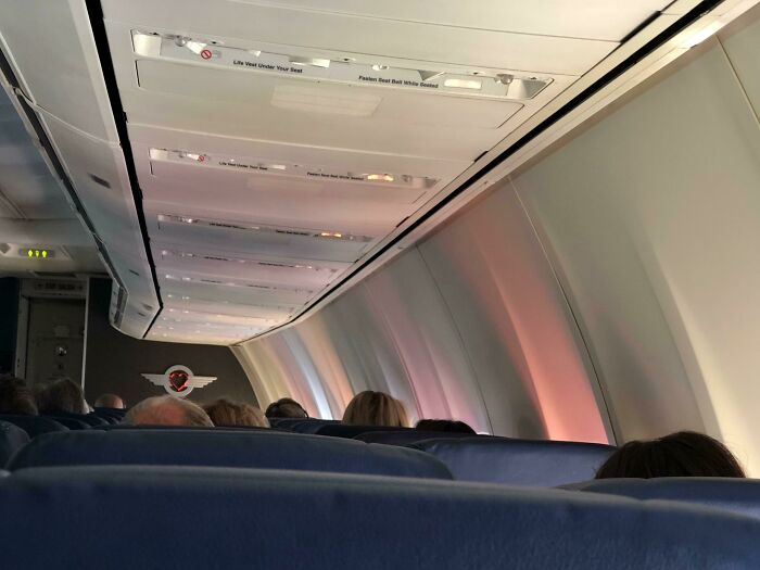 The Colorful Reflections From People’s Shirts On My Airplane