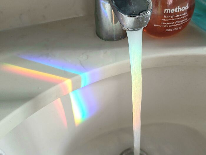 The Refraction Rainbow From My Glass Shower Door Lined Up Perfectly With The Water Stream In My Sink