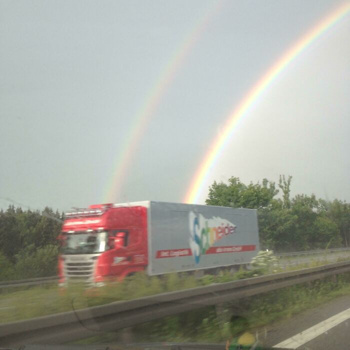 A Double Rainbow Coming Out Of A Rainbow Colored Truck On The Autobahn