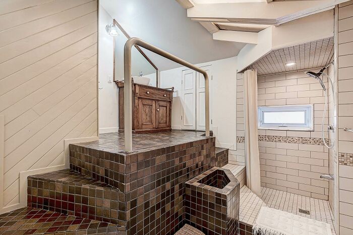Because Having Two Staircases Is Better Than One In The Bathroom. Toilet Is Behind The Wall On The Left.