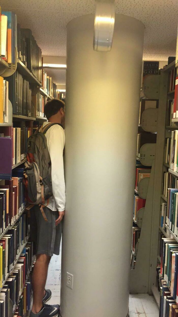 This Is The Library At My College. Shelves Right Around A Support Beam That Are Nearly Impossible To Get To