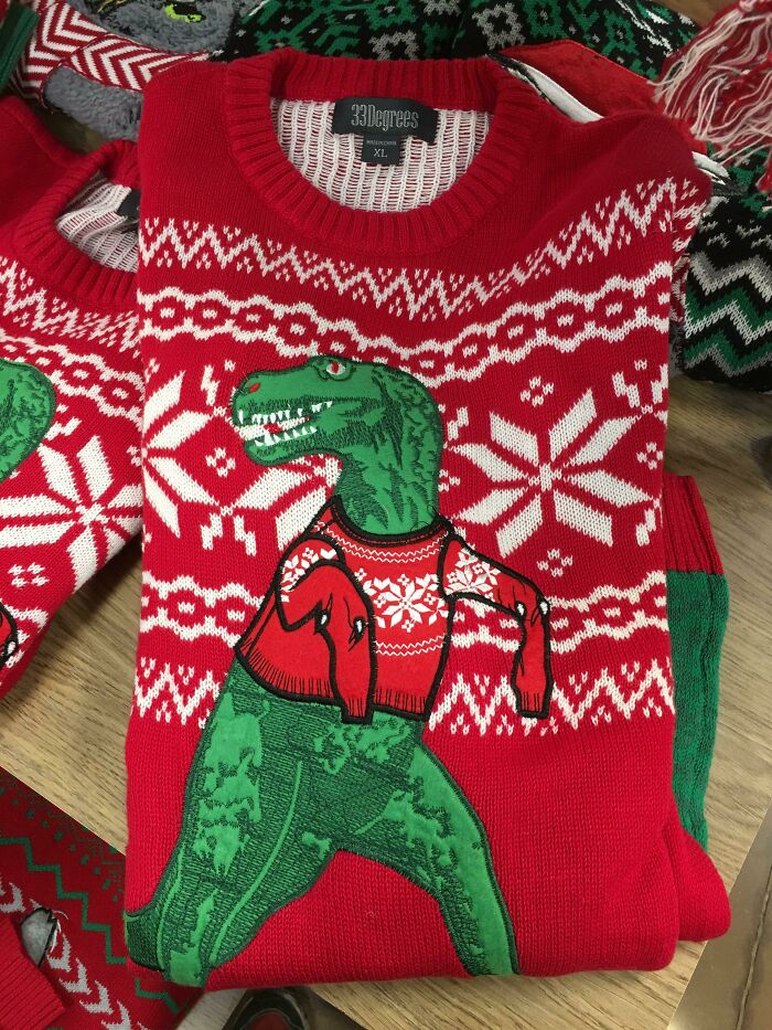 The Dangling Sleeves On This T-Rex Christmas Sweater