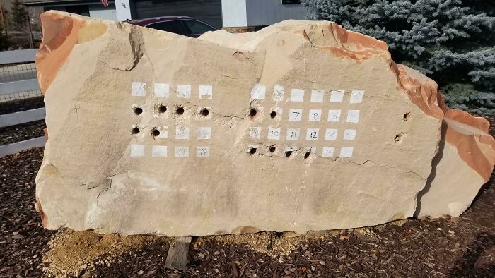 In Someone's Front Yard In Utah. A Few Neighbors Had Them. Holes Were Drilled Into Certain Squares In The Grid