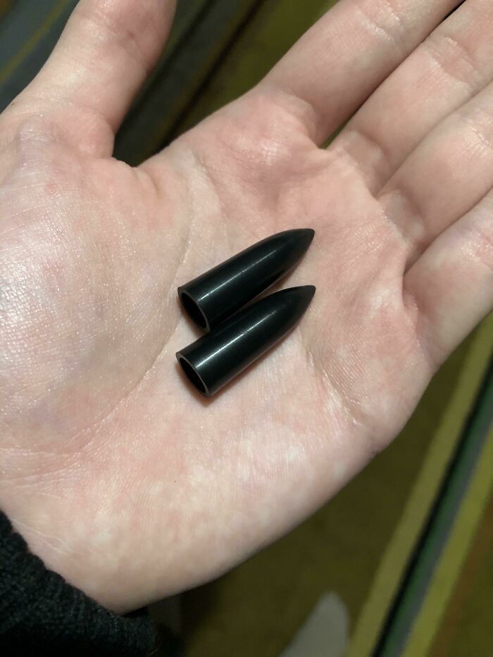 Two Plastic Bullet-Type Things I Found In The Pen Pokets Of My Alpha Industries Bomber Jacket