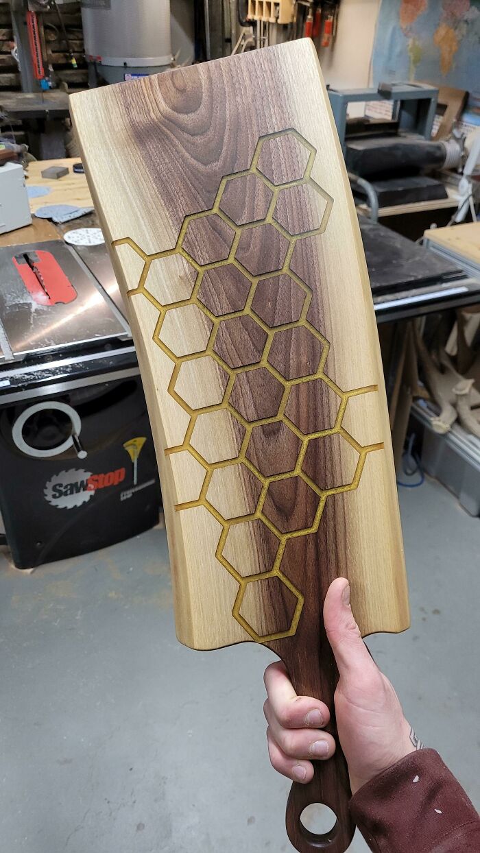 First Attempt At A Honeycomb, I Will Be Adding A Little Handcarved Bee To It Very Soon. I Used A 3/16 Downcut And Only Went In About A 1/4". Metallic Pineapple Epoxy Sanded Flush To 500g With Black Walnut