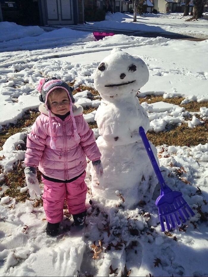 She Nailed Her First Attempt At Building A Snowman, Right Down To The Facial Expression