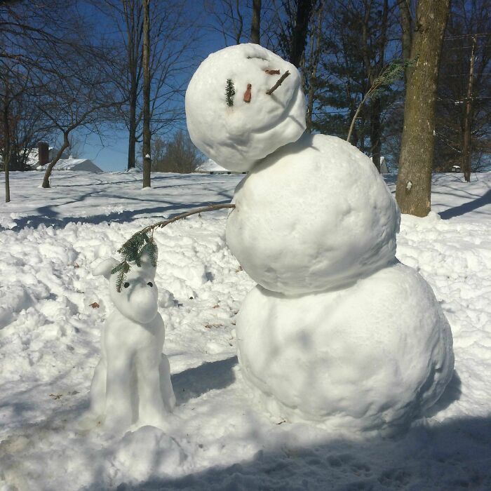 My Snowman Started To Sag In The Sun And Now Looks Like He Is Petting His Snowdog