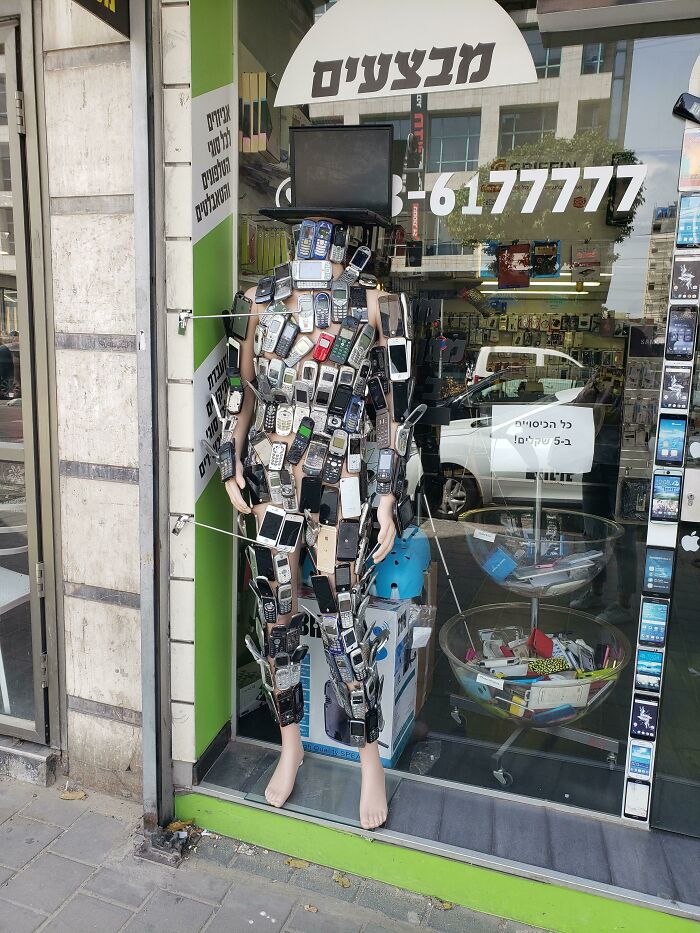 This Mannequin Outside Of A Cellphone Repair Shop