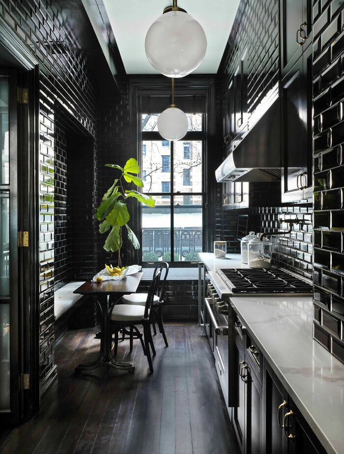 Apartment Kitchen Clad Entirely In Black Tiles With An Eat-In Banquette, New York City