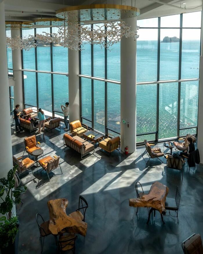 Cafe With Glass Walls Offering Sweeping Ocean Vistas In Yeosu, South Jeolla Province, South Korea