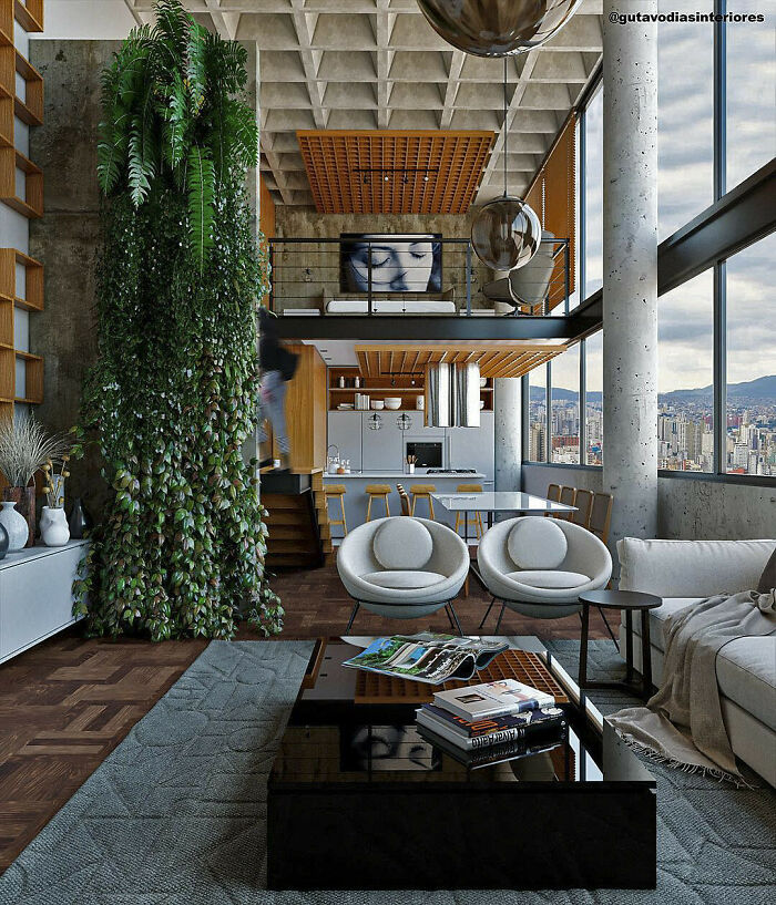 Un apartamento industrial de doble altura con una sala de estar abierta con una mezcla de vegetación, Brasil