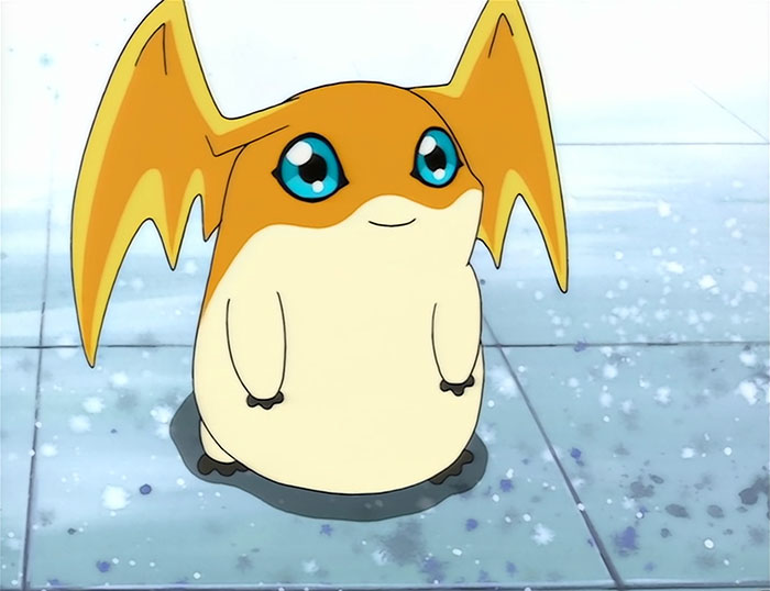 Cute animated character with large blue eyes and orange bat-like wings, standing on a tiled floor.