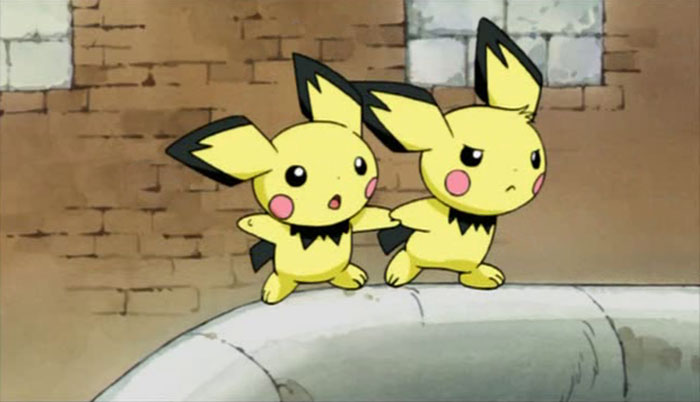 Two cute animated characters, Pichu, standing on a stone ledge, showcasing their adorable expressions.