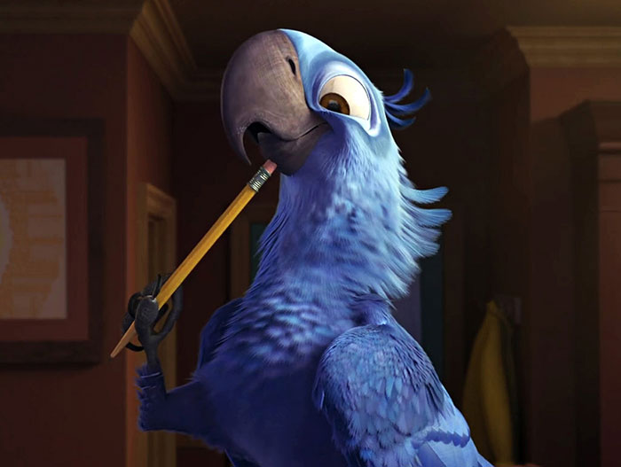 Cute animated character, a blue parrot, holding a pencil in its beak in a cozy room setting.