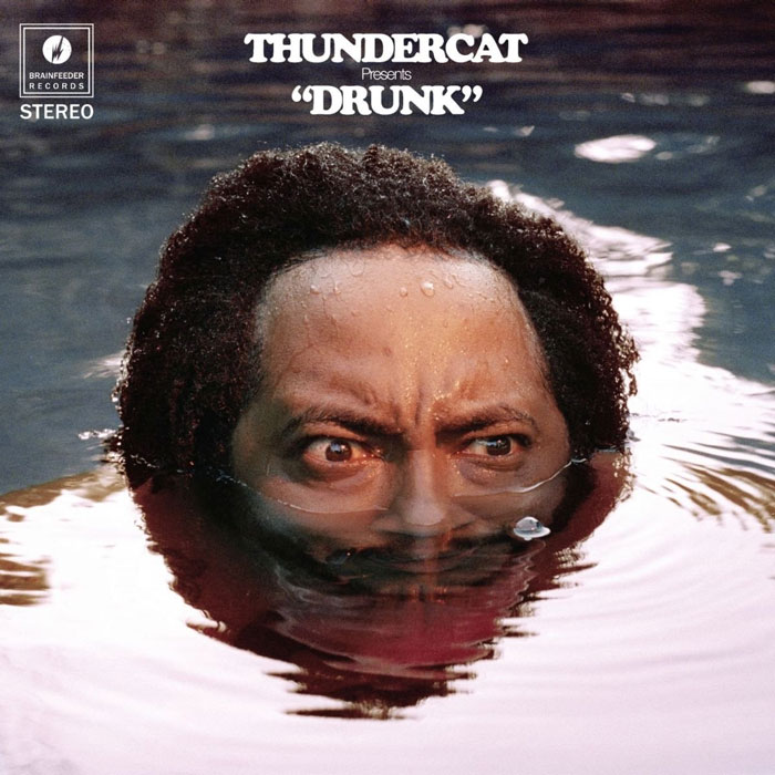 Album cover of Thundercat's "Drunk" featuring his face partially submerged in water.