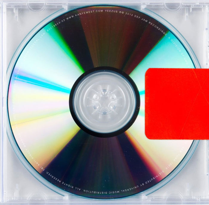 Minimalist album cover featuring a CD in a clear case with a red sticker, showcasing great design.