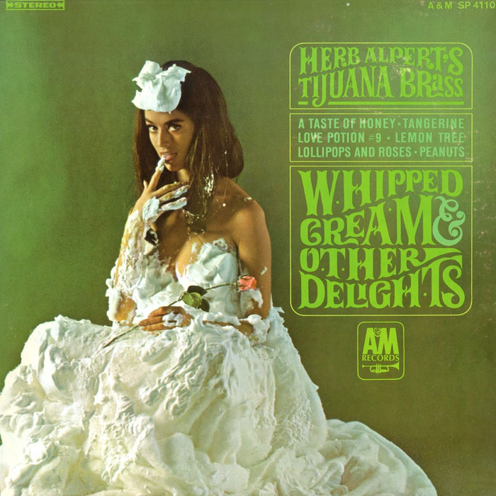 Album cover of "Whipped Cream & Other Delights" by Herb Alpert's Tijuana Brass, iconic design with whipped cream.