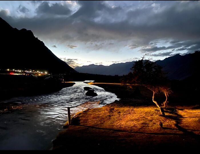 Car Headlights Illuminating A Creek, Nubra Valley, Ladakh, India