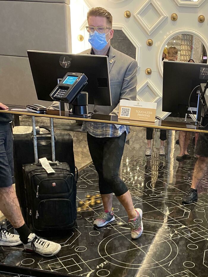 The Reflection In The Mirror On This Hotel Check In Desk