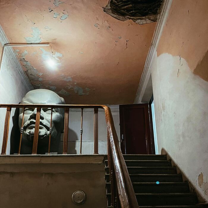 A Massive Lenin Bust Hiding In An Apartment Building Stairwell In Khujand, Tajikistan. Photo - Artyom Kushneruk