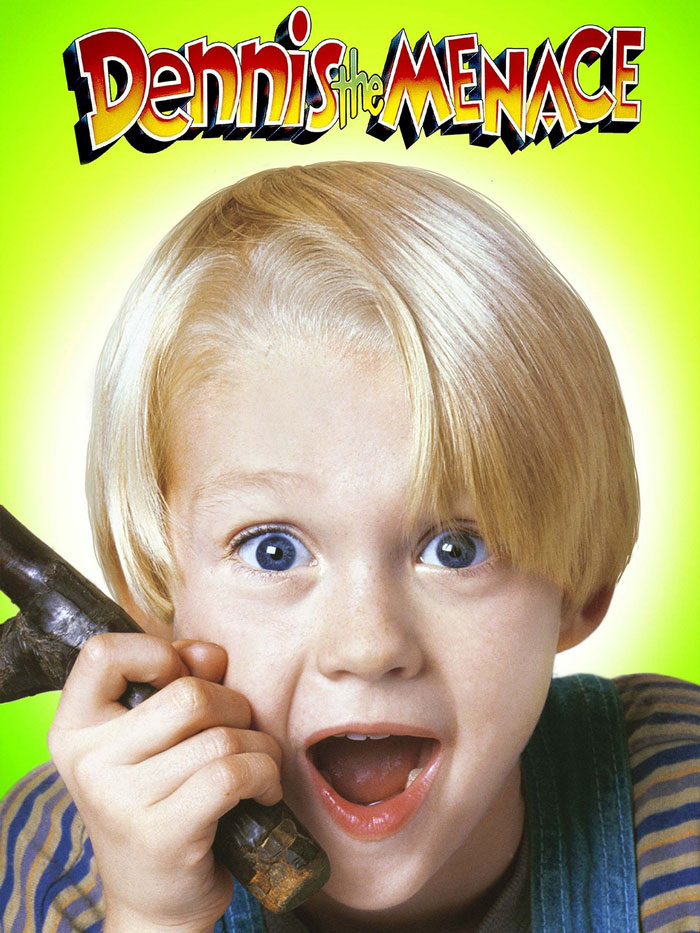 Child character from a '90s kids movie holding a slingshot, looking surprised against a bright background.