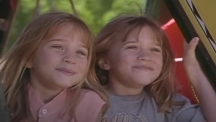 Two young girls smiling together in a car, representing popular actors not born into wealth or connections. Two young girls smiling together in a car, representing popular actors not born into wealth or connections.