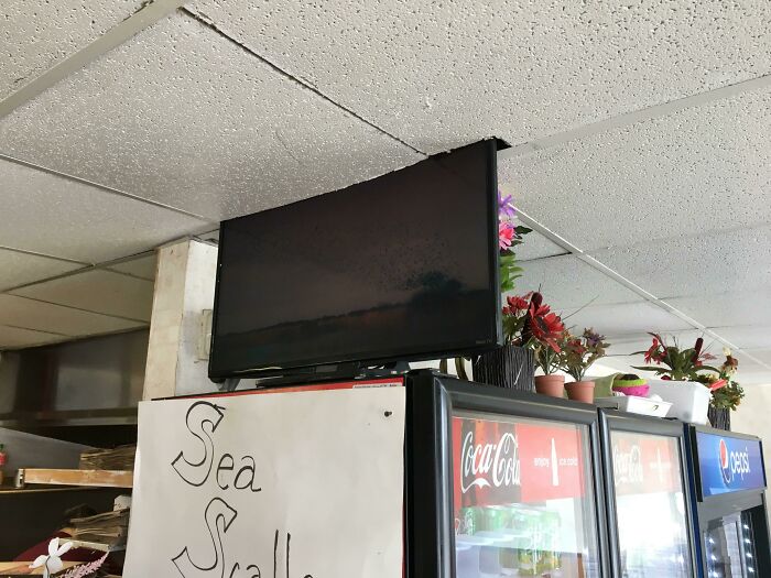 Local Pizza Place Cut A Hole In The Ceiling For The TV