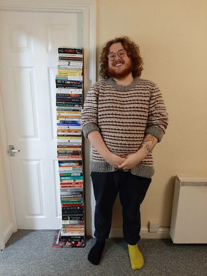 I Read 71 Books In 2021, Here Is A Photo Next To All Of Them, I Am 5'9" For Reference
