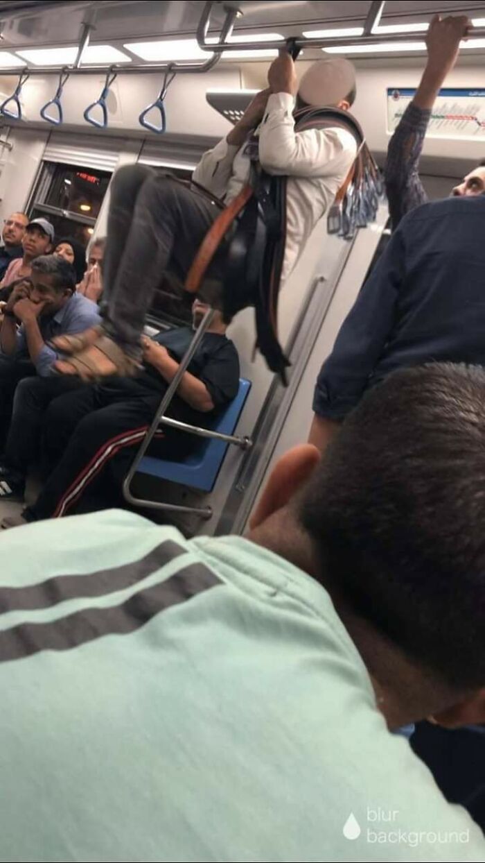 This Guy Hanging From One Of His Belts To Show People That His Belts Are Good Quality. Egyptian Metro Sellers Are A Different Species.