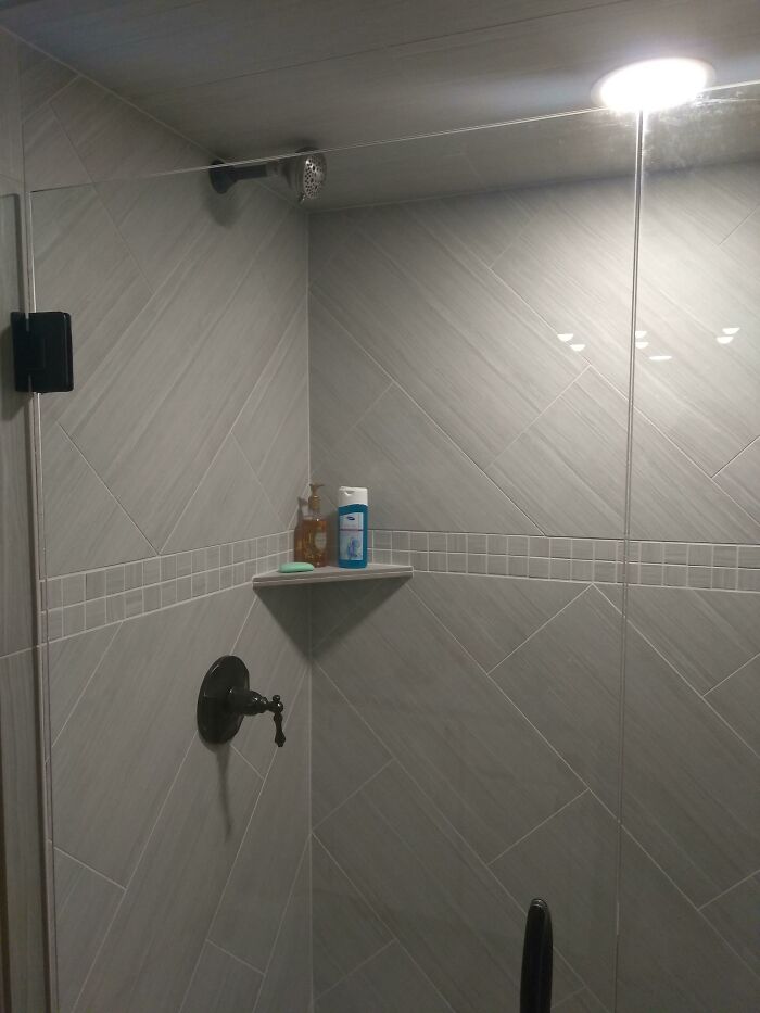 My Mom Had Her Guest Bathroom Remodeled While She Was Out Of Town. She Wanted The Shower Head Up High So Tall People Didn't Have To Crouch Or Lean Way Back. Came Home To Find This, Which Shoots The Water Straight Across To The Opposite Wall