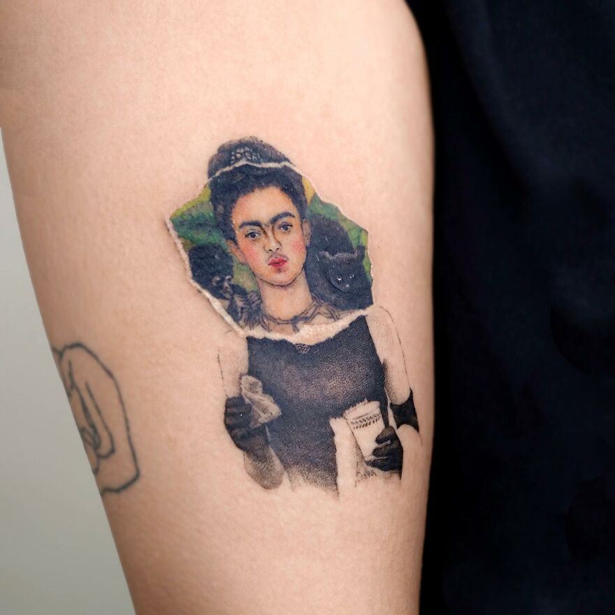 Painting-like tattoo of a woman with monkeys on skin, showcasing artist's detailed work.