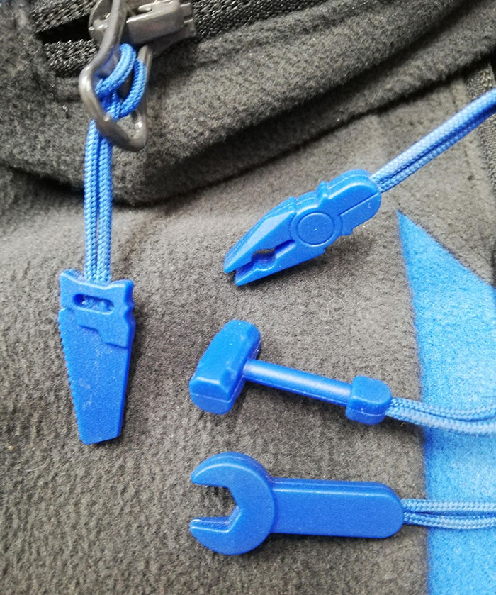 My Workwear Has Little Tools On The Zippers