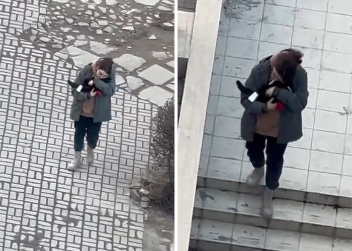 Woman Carries And Comforts Cat Amid Air Raid Sirens Sounding In Kyiv, Ukraine Woman Carries And Comforts Cat Amid Air Raid Sirens Sounding In Kyiv, Ukraine