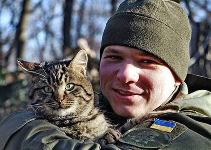 Woman Carries And Comforts Cat Amid Air Raid Sirens Sounding In Kyiv, Ukraine Woman Carries And Comforts Cat Amid Air Raid Sirens Sounding In Kyiv, Ukraine