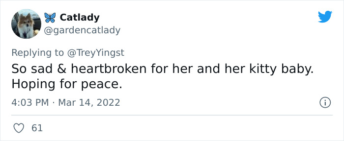 Woman Carries And Comforts Cat Amid Air Raid Sirens Sounding In Kyiv, Ukraine Woman Carries And Comforts Cat Amid Air Raid Sirens Sounding In Kyiv, Ukraine